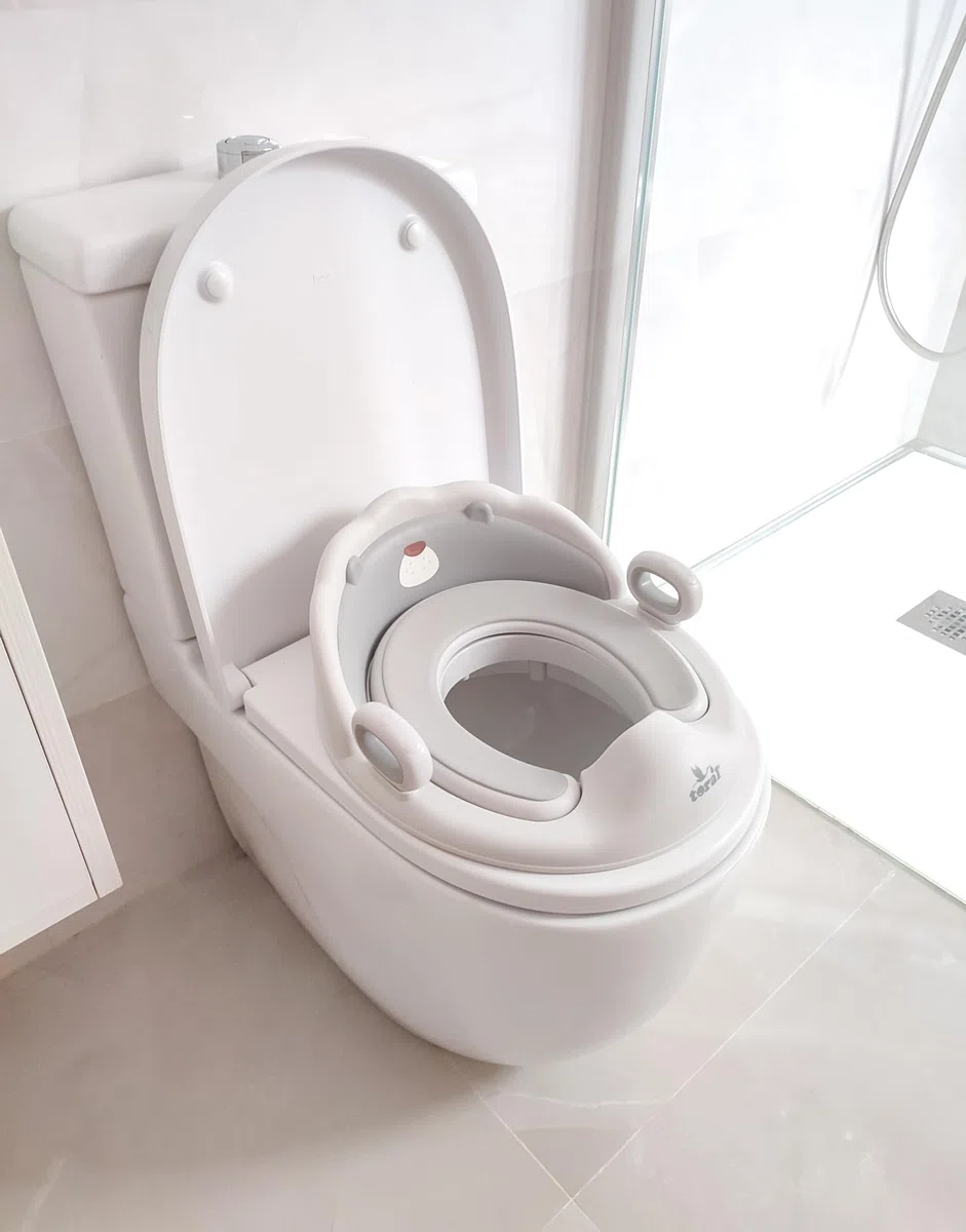 Toral Asiento Reductor con Asas para WC. Ayuda al aprendizaje de bebés y niños. Adaptador infantil portátil para váter MundiBebé +18 meses. Modelo Confort Osito